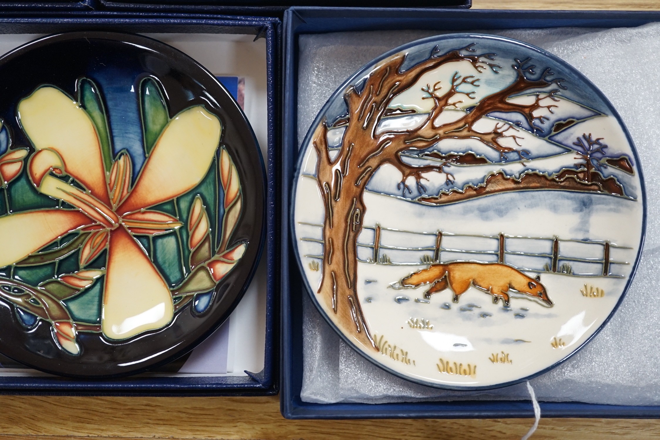 Six boxed Moorcroft pin dishes, A Woodside Farm, Panache, Simeon, Triple Choice, and Anna Lily. Each 11.5cm diameter